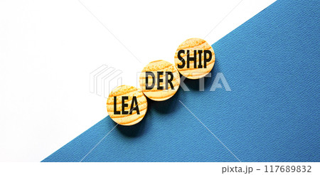 Leadership symbol. Concept word Leadership on beautiful wooden circles. Beautiful blue white background. Business leadership concept. Copy space. 117689832