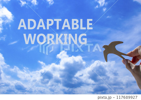 Adaptable working symbol. Concept words Adaptable working on beautiful sky. Beautiful blue sky cloud background. Businessman hand with wooden bird. Business Adaptable working concept. Copy space. Adaptable working symbol. Concept words Adaptable working on beautiful sky. Beautiful blue sky cloud background. Businessman hand with wooden bird. Business Adaptable working concept. Copy space. 117689927