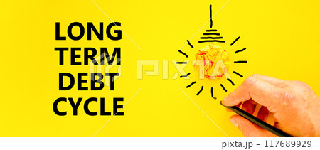 Long term debt cycle symbol. Concept words Long term debt cycle on beautiful yellow paper. Beautiful yellow background. Businessman hand. Business Long term debt cycle concept. Copy space. Long term debt cycle symbol. Concept words Long term debt cycle on beautiful yellow paper. Beautiful yellow background. Businessman hand. Business Long term debt cycle concept. Copy space. 117689929