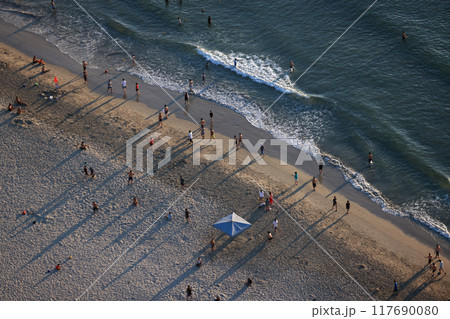 In the evening, the shadows of the hotels stretch towards My Khe beach in Da Nang, Vietnam. In the evening, the shadows of the hotels stretch towards My Khe beach in Da Nang, Vietnam. 117690080