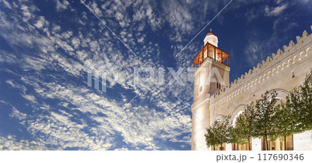 King Hussein Bin Talal mosque in Amman (at night), Jordan.  Against the background of a beautiful sky with clouds 117690346