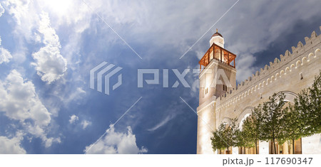 King Hussein Bin Talal mosque in Amman (at night), Jordan. Against the background of a beautiful sky with clouds King Hussein Bin Talal mosque in Amman (at night), Jordan. Against the background of a beautiful sky with clouds 117690347