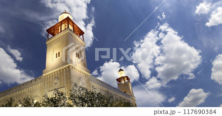 King Hussein Bin Talal mosque in Amman (at night), Jordan. Against the background of a beautiful sky with clouds King Hussein Bin Talal mosque in Amman (at night), Jordan. Against the background of a beautiful sky with clouds 117690384
