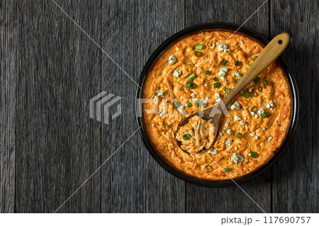 hot buffalo chicken dip in baking dish, top view 117690757