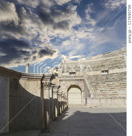 Roman Theatre in Amman, Jordan -- theatre was built the reign of Antonius Pius (138-161 CE), the large and steeply raked structure could seat about 6000 people. Against the sky with clouds Roman Theatre in Amman, Jordan -- theatre was built the reign of Antonius Pius (138-161 CE), the large and steeply raked structure could seat about 6000 people. Against the sky with clouds 117690786
