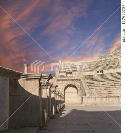 Roman Theatre in Amman, Jordan -- theatre was built the reign of Antonius Pius (138-161 CE), the large and steeply raked structure could seat about 6000 people. Against the sky with clouds 117690787