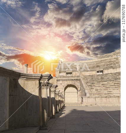 Roman Theatre in Amman, Jordan -- theatre was built the reign of Antonius Pius (138-161 CE), the large and steeply raked structure could seat about 6000 people. Against the sky with clouds 117690788