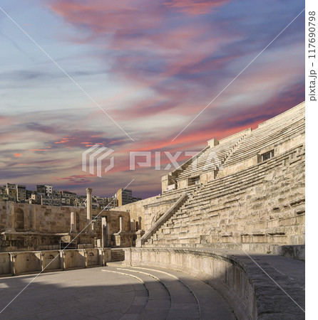 Roman Theatre in Amman, Jordan -- theatre was built the reign of Antonius Pius (138-161 CE), the large and steeply raked structure could seat about 6000 people. Against the sky with clouds Roman Theatre in Amman, Jordan -- theatre was built the reign of Antonius Pius (138-161 CE), the large and steeply raked structure could seat about 6000 people. Against the sky with clouds 117690798
