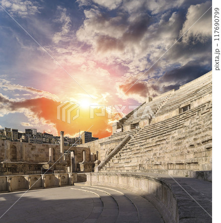 Roman Theatre in Amman, Jordan -- theatre was built the reign of Antonius Pius (138-161 CE), the large and steeply raked structure could seat about 6000 people. Against the sky with clouds Roman Theatre in Amman, Jordan -- theatre was built the reign of Antonius Pius (138-161 CE), the large and steeply raked structure could seat about 6000 people. Against the sky with clouds 117690799