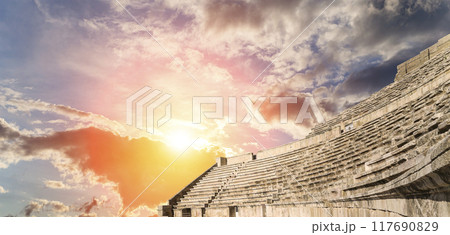 Roman Theatre in Amman, Jordan -- theatre was built the reign of Antonius Pius (138-161 CE), the large and steeply raked structure could seat about 6000 people. Against the sky with clouds Roman Theatre in Amman, Jordan -- theatre was built the reign of Antonius Pius (138-161 CE), the large and steeply raked structure could seat about 6000 people. Against the sky with clouds 117690829