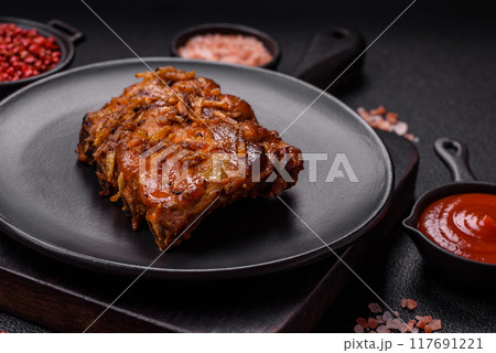 Delicious juicy grilled ribs with honey and mustard sauce with salt, spices and herbs Delicious juicy grilled ribs with honey and mustard sauce with salt, spices and herbs 117691221