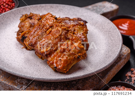 Delicious juicy grilled ribs with honey and mustard sauce with salt, spices and herbs 117691234