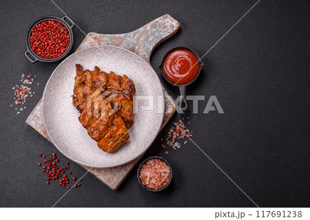 Delicious juicy grilled ribs with honey and mustard sauce with salt, spices and herbs Delicious juicy grilled ribs with honey and mustard sauce with salt, spices and herbs 117691238