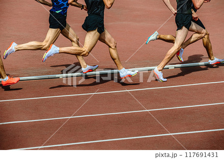 group athletes running 800 meters at stadium 117691431