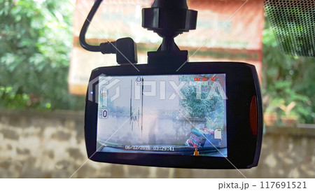 Malfunctioning car CCTV monitor displaying distorted lines, concept of car insurance 117691521