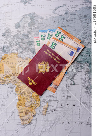 Conceptual background for travel with passport, magnifying glass, world map and money 117691608