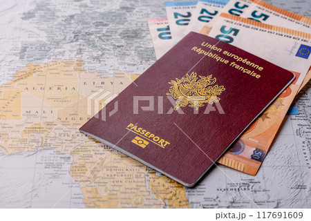 Conceptual background for travel with passport, magnifying glass, world map and money Conceptual background for travel with passport, magnifying glass, world map and money 117691609