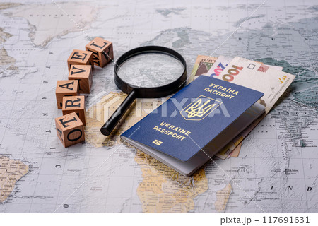 Conceptual background for travel with passport, magnifying glass, world map and money 117691631
