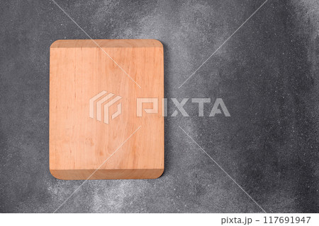 Empty wooden cutting board. Kitchen utensils 117691947