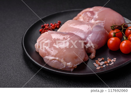 Fresh chicken fillet on a dark concrete table with spices and herbs 117692060