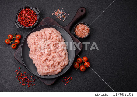Fresh raw chicken mince with salt and spices 117692102