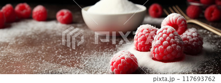 some sugar and some raspberries on a table, powder, looking partly to the left, 117693762
