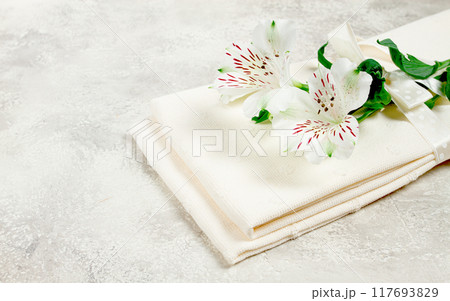 kitchen towels, cream color, with alstroemeria, Peruvian lily, top view, concept, decor, no people, 117693829