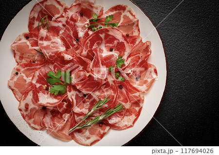 sliced cured ham, prosciutto, italian dish, delicacy, parma ham, top view, no people, 117694026