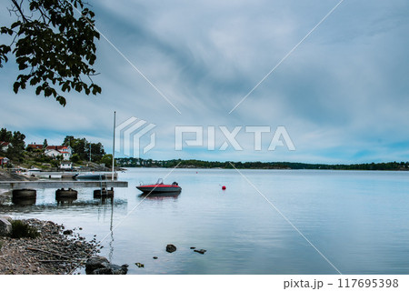 Midnight sea sky in Sweden during light summer nights. Midnight sea sky in Sweden during light summer nights. 117695398