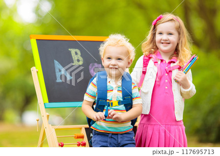 Children happy to be back to school 117695713