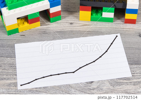 Houses made of toy blocks and rising graph Houses made of toy blocks and rising graph 117702514