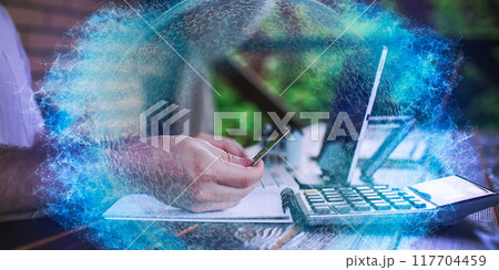 A man adds items to his cart while shopping in an international online store. E-commerce marketing offers discounts and free home delivery from any country. A man adds items to his cart while shopping in an international online store. E-commerce marketing offers discounts and free home delivery from any country. 117704459
