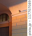 Architectural detail of the facade of a building in the evening 117707089