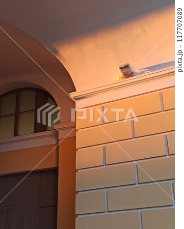 Architectural detail of the facade of a building in the evening Architectural detail of the facade of a building in the evening 117707089