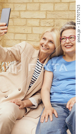 Joyful Friendship Capturing Beautiful and Memorable Moments in a Fun Selfie Experience Joyful Friendship Capturing Beautiful and Memorable Moments in a Fun Selfie Experience 117707525