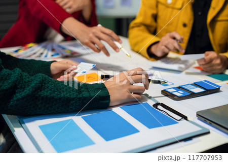 UX developer and ui designer brainstorming about mobile app interface wireframe design with customer breif and color code, User experience concept 117707953