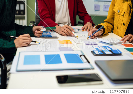 UX developer and ui designer brainstorming about mobile app interface wireframe design with customer breif and color code, User experience concept UX developer and ui designer brainstorming about mobile app interface wireframe design with customer breif and color code, User experience concept 117707955