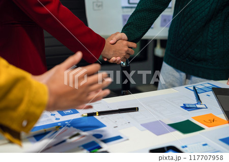 UX developer and ui designer brainstorming about mobile app interface wireframe design with customer breif and color code, User experience concept UX developer and ui designer brainstorming about mobile app interface wireframe design with customer breif and color code, User experience concept 117707958