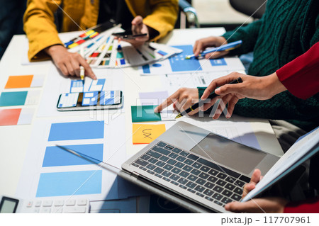 UX developer and ui designer brainstorming about mobile app interface wireframe design with customer breif and color code, User experience concept UX developer and ui designer brainstorming about mobile app interface wireframe design with customer breif and color code, User experience concept 117707961