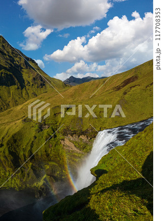 Picturesque full of water big waterfall Skogafoss autumn view, southwest Iceland. Picturesque full of water big waterfall Skogafoss autumn view, southwest Iceland. 117708353