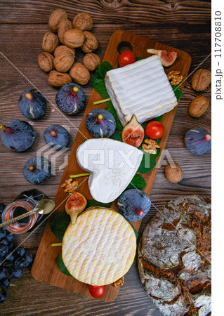 Selection of French cheeses from Normandy, AOP, Livarot, Neufchatel, Pont l'eveque, Rye bread, figs Selection of French cheeses from Normandy, AOP, Livarot, Neufchatel, Pont l'eveque, Rye bread, figs 117708810
