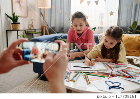 Children Playing and Drawing at Home Together 117709161