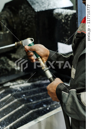 Operating Industrial Cutting Machine in Production Facility 117710777