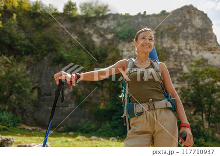 An Adventurous Hiker Exploring the Breathtaking Beauty of Nature with a Scenic Background An Adventurous Hiker Exploring the Breathtaking Beauty of Nature with a Scenic Background 117710937
