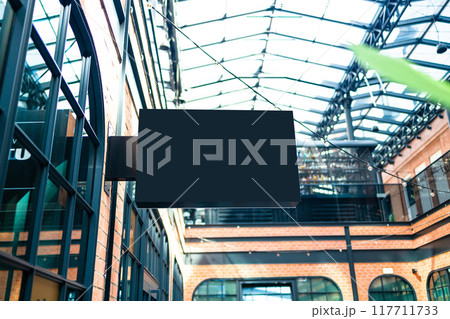 Horizontal side view of empty black signage on business skyscraper with modern architecture Horizontal side view of empty black signage on business skyscraper with modern architecture 117711733