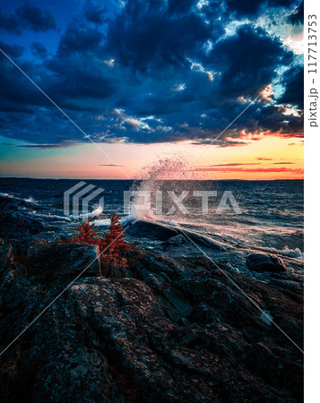 Splashing wave on the lake Melaren in the night. Splashing wave on the lake Melaren in the night. 117713753