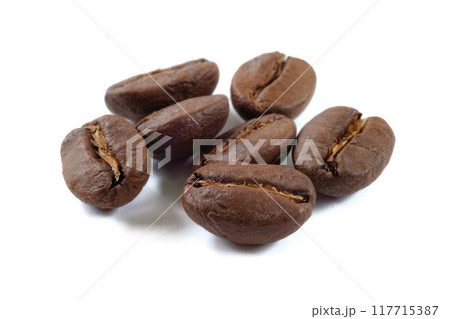 Coffee beans isolate close up on white background . Coffee beans isolate close up on white background . 117715387