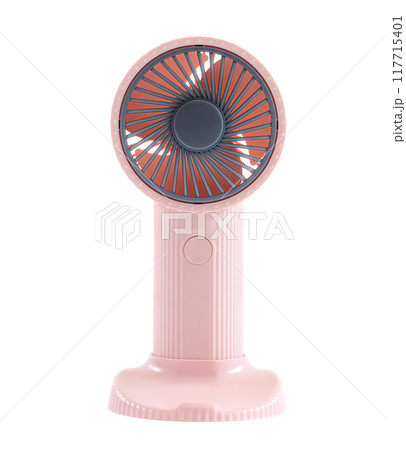 Pink portable fan close up on white background . 117715401
