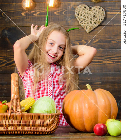 Harvest festival concept. Child little girl enjoy farm life. Organic gardening. Girl kid  117717930