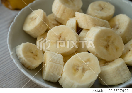 Sliced banana on the table at the kitchen 117717990